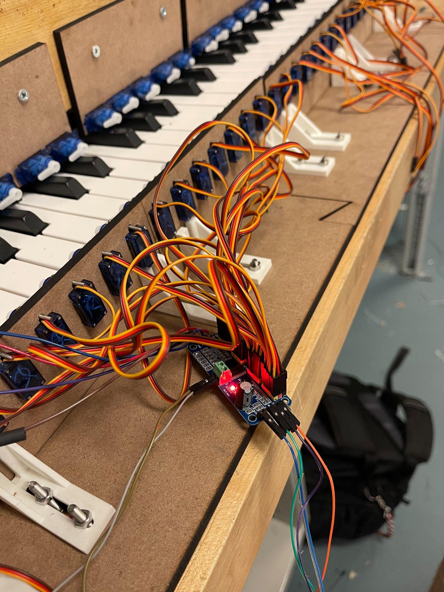 PCA9685 servo driver connected to many micro servos on a keyboard prototype